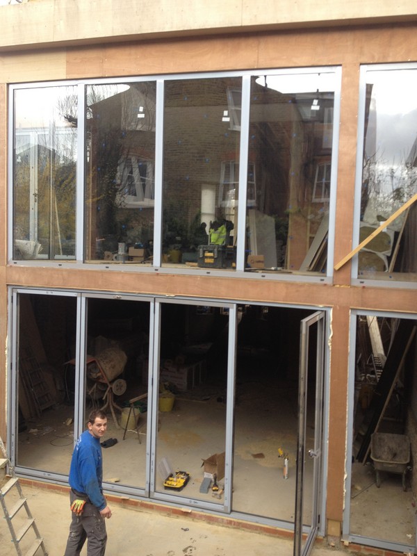 Aluminium bi-fold doors with two-storey glazing in Bloomsbury