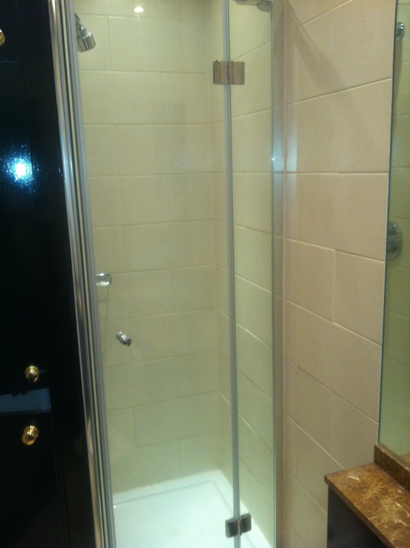 Frameless glass shower enclosure with chrome fittings in Bloomsbury